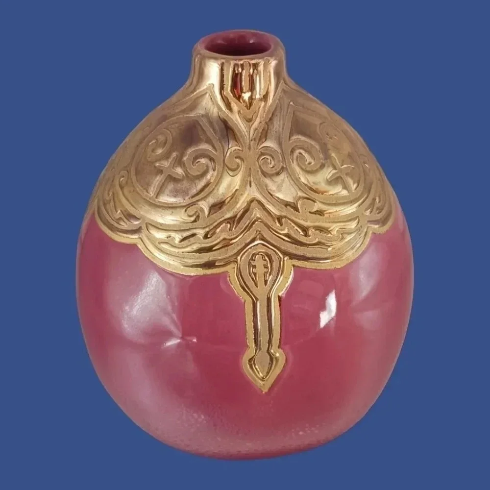 Vintage ceramic engraved  vase topped with enameled gold glazed